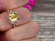 1.50 Carat Emerald Cut Champagne Diamond Moissanite Engagement Ring 10k Rose Gold Promise Ring for Bride or Anniversary Gift Startling Jewelry Twisted Across Design Halo Art Deco