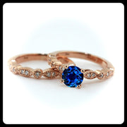 2.00 carat Round Cut Sapphire and Moissanite Diamond Halo Bridal Set in 10k Rose Gold