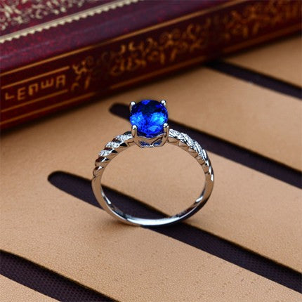 1 Carat Sapphire and Moissanite Diamond Halo Engagement Ring in White Gold