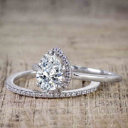 2 Carat Pear cut Moissanite and Diamond Halo Wedding Ring Set in White Gold
