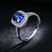 2 Carat Classic oval cut Sapphire and Moissanite Diamond Halo Engagement Ring in White Gold