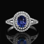 2 Carat oval cut Blue Sapphire and Moissanite Diamond Halo Engagement Ring in White Gold