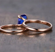 1.25 carat Blue Sapphire and Moissanite Diamond Halo Bridal Set in 10k Rose Gold