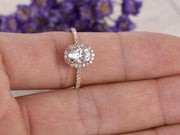 Classic Oval Cut 1.50 Ct Moissanite and Diamond Halo Wedding Ring in Rose Gold
