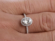 Oval Cut 1.25 ct Halo Moissanite and Diamond Engagement Ring in White Gold
