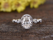 Oval cut 1.25 Ct Halo Moissanite and Diamond Engagement Ring in 10k White Gold
