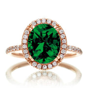1.5 Carat Oval Classic Emerald and Moissanite Diamond halo ring on 10k Rose Gold