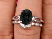 1.50 Carat Oval Cut Black Diamond Moissanite Bridal Ring Set With Curved Loop Stacking Matching Wedding Band On 10k White Gold