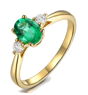 Trilogy Half Carat oval cut Emerald and Round Moissanite Diamond Engagement Ring in Yellow Gold