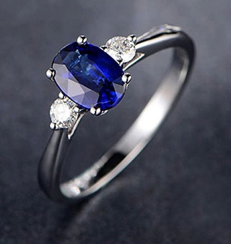 Trilogy Half Carat oval cut Sapphire and Round Moissanite Diamond Engagement Ring in White Gold