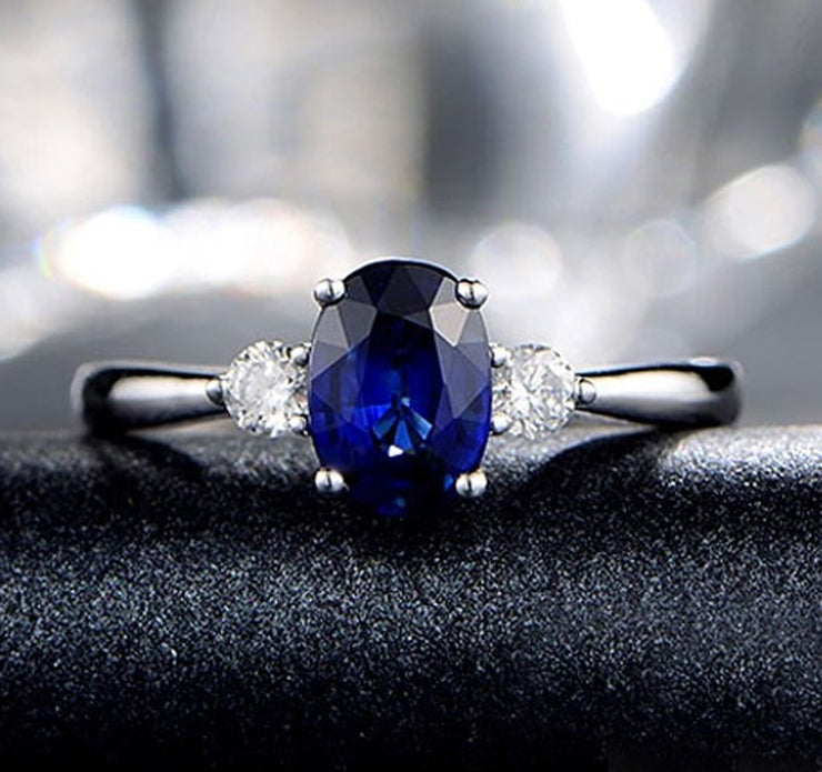 Trilogy Half Carat oval cut Sapphire and Round Moissanite Diamond Engagement Ring in White Gold