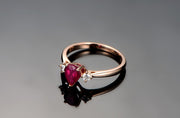 Trilogy Half Carat Pear Shape Ruby and Round Moissanite Diamond Engagement Ring in Rose Gold